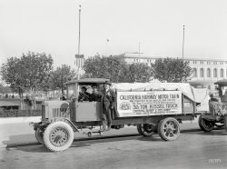 October 1919. "California Highway Motor Train in San Francisco." A publicity stunt showcasing the nascent field of long-distance trucking as facilitated by the "giant pneumatic tire." The cargo here being three tons of Cherry Flip. 6½ x 8½ inch glass negative, originally from the Wyland Stanley collection. View full size.