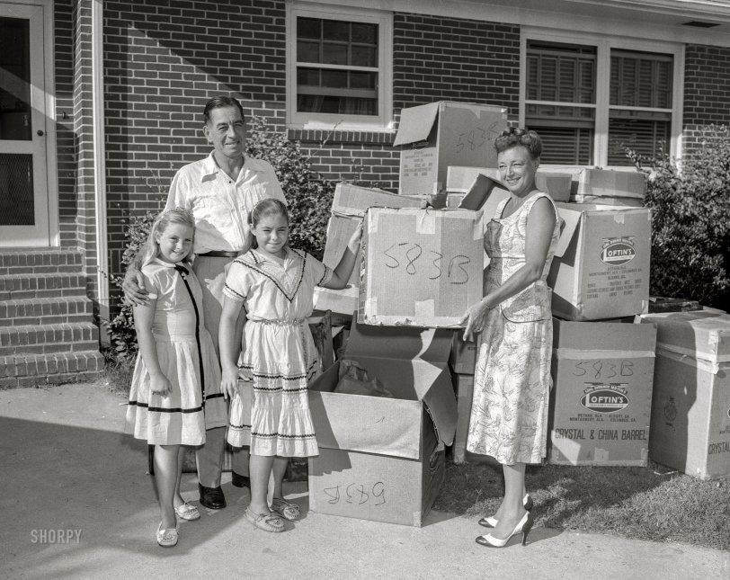 From Columbus, Georgia, circa 1957 comes this News Archive photo of a happy family on moving day. The twins are unpacked, and now all they have to do is find the box Junior is in. (This post brought to you by Loftin's Transfer &amp; Storage.) 4x5 acetate negative. View full size.
