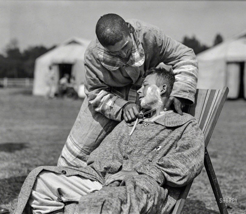 June 1918. "A serious operation by the Company Barber at American Military Hospital No. 5 at Auteuil, France. A complete portable tent hospital supported by the American Red Cross on the site of what was before the war a celebrated race-course." 5x7 glass negative by Lewis Hine. View full size.
