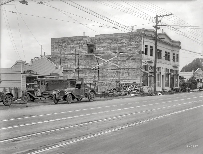 San Mateo County, California, 1924. "Daly City Deputy Health Officer and construction trucks." Also the quarters of the Constable, not to mention "Oiling &amp; Greasing." 6½ x 8½ inch glass negative by Christopher Helin. View full size.
