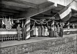 July 1918. "American Red Cross Canteen at Gare d'Ivry, Paris, showing decorations in honor of the Fourth of July, which was celebrated by the French as well as by the Americans." Photo by Lewis Hine for the American Red Cross. View full size.