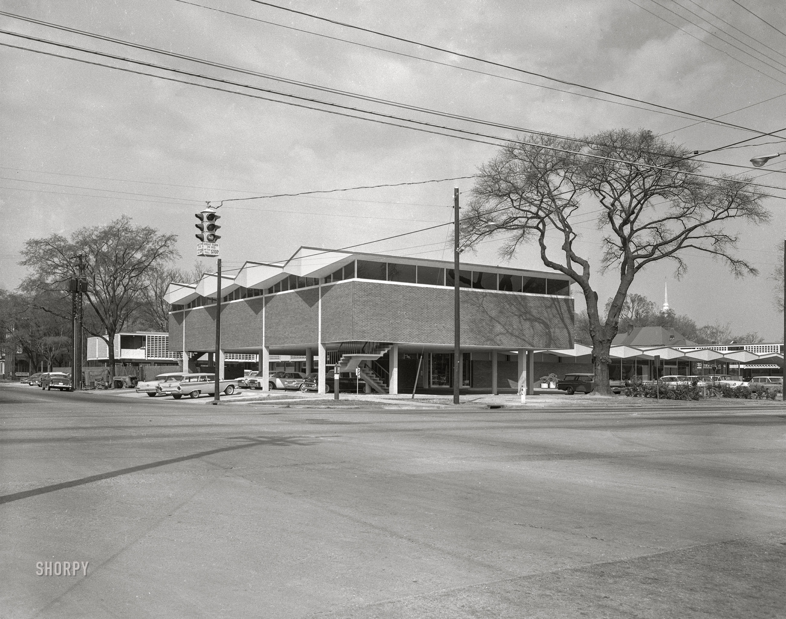 Columbus, Georgia, circa 1962. Our second look at the Martinique Motor Hotel, last seen here from different spatial and seasonal vantages. 4x5 inch acetate negative. View full size.