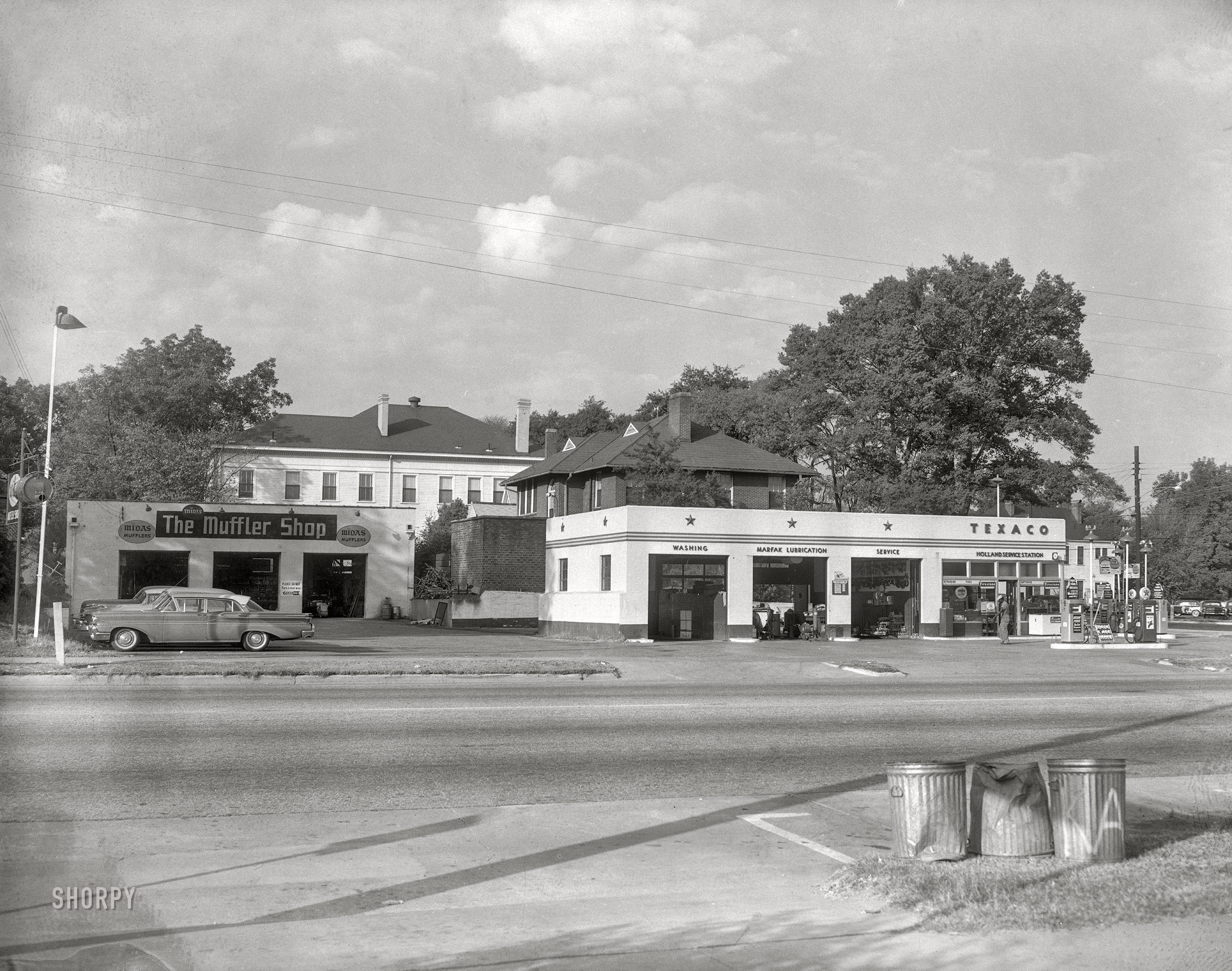 From circa 1960 Columbus, Georgia, comes this News Archive photo of a Midas Muffler Shop next to Holland's Texaco service. Fill 'er up with Su-Preme! 4x5 acetate negative. View full size.