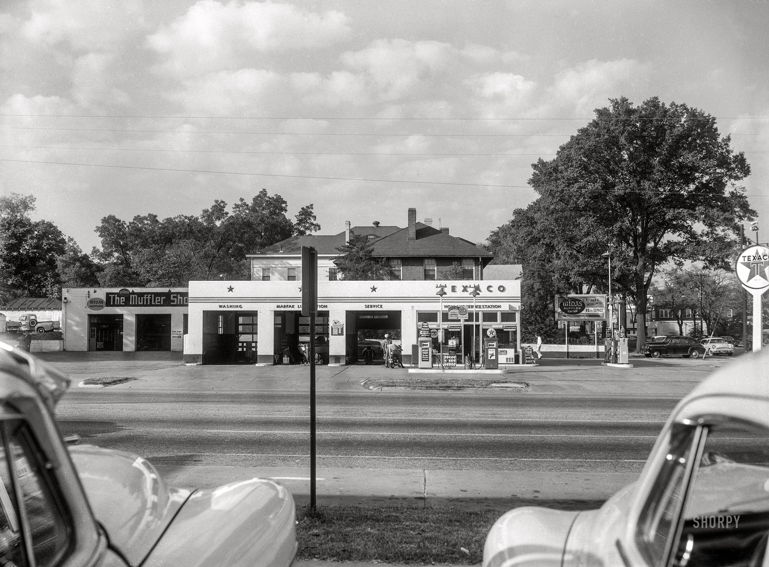 Columbus, Georgia, circa 1960. Our second look at John Holland's Texaco service station (and Midas Muffler shop, and "Official Georgia Tourist Welcome Station") on 13th Street.  4x5 inch acetate negative from the Shorpy News Photo Archive. View full size.
