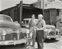 San Francisco, 1941. "Pontiacs being unloaded from freight cars." Slathered with chrome. 8x10 Eastman Kodak Safety Film negative. View full size.