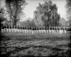 Circa 1920. "V.P.I. Cadet Company 'B'." The men of Virginia Polytechnic Institute in Blacksburg. Harris &amp; Ewing Collection glass negative. View full size.
Where is the HokieBird?It's probably before the mascot's time, but I still searched the trees with negative results.  If this were colorized what color would the coats be?  Chicago maroon/burnt orange possibly?  
And just 3 years later, 1923, the 4 year compulsory participation in the Corps of Cadets was lowered to 2 years. 
Where&#039;s the bugle boy?Maybe it's a bit too early to sing about him.
Corps blousesThe blouses were blue, assuming the color didn't change in the 60 years until I wore one.
(The Gallery, Harris + Ewing)
