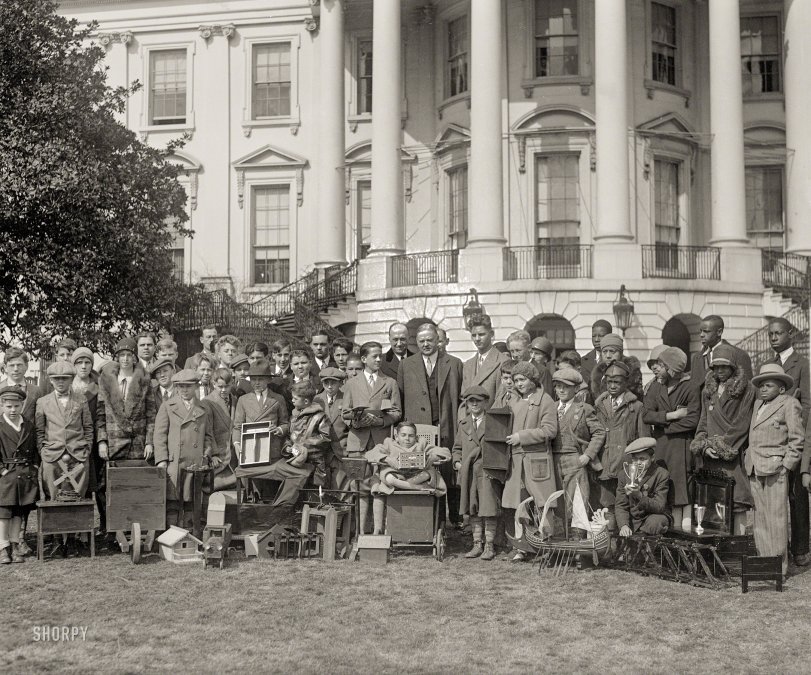 Circa 1930. "No caption (President Hoover with boys and girls at White House)." Who can help us fill in the blanks? National Photo Co. View full size.
