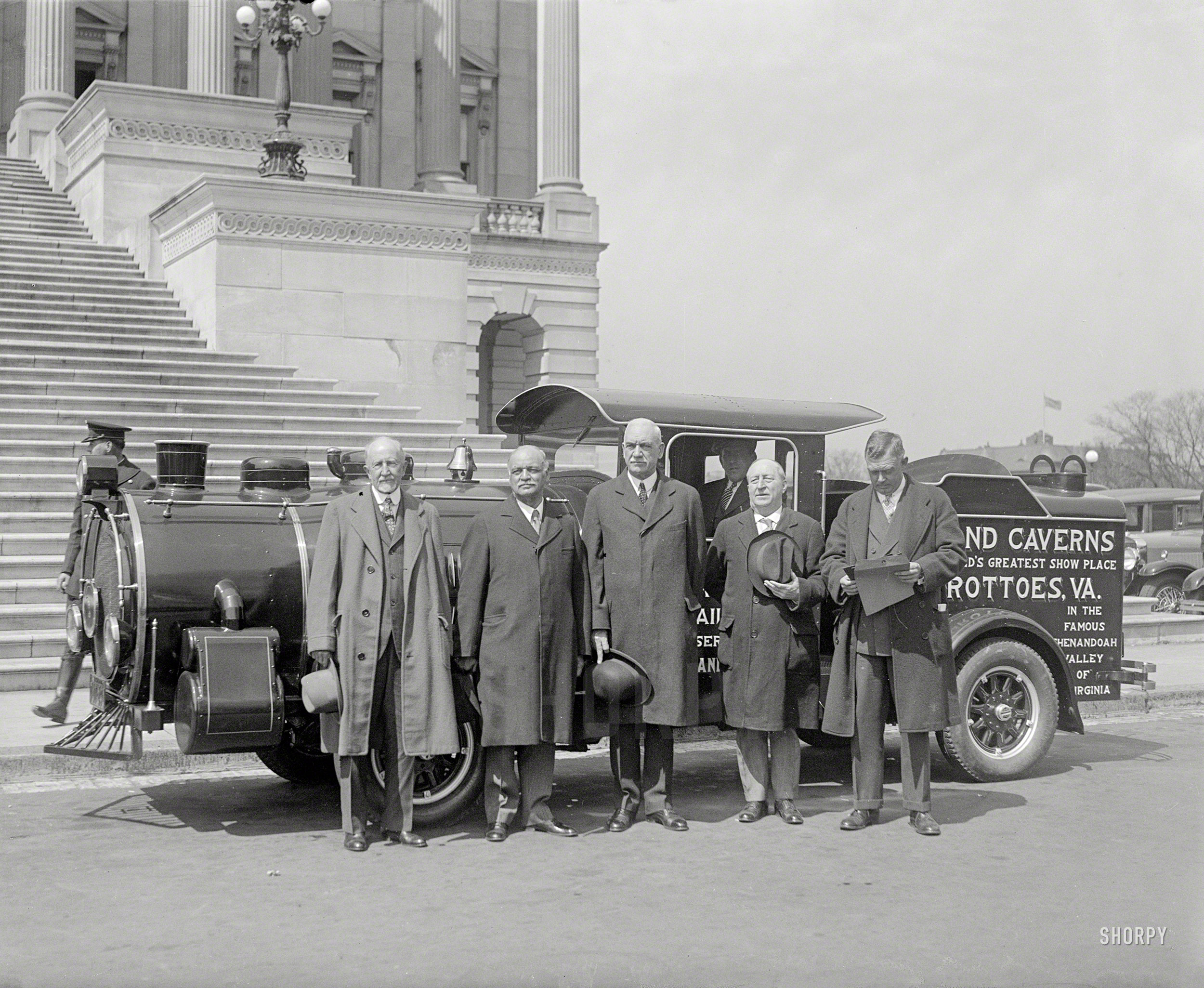Circa 1930. "Vice President Curtis at Capitol with steam car." Which, as evidenced by the news item below, encountered a bit of trouble during its stop in Washington. National Photo Co. Collection glass negative. View full size.Auto Locomotive Leads to Arrest
Man to Be Tried for Using Car
For Advertising Railroad.
The Washington Post -- May 17, 1930

&nbsp; &nbsp; &nbsp; &nbsp; Albert E. Lentz, of 501 Twelfth street northwest, will be tried in Police Court next Thursday on charges of using a motor vehicle for advertising purposes and of driving an automobile with view obstructed.
&nbsp; &nbsp; &nbsp; &nbsp; The latter charge was placed against the man after traffic officials had inspected the vehicle, a locomotive on an automobile chassis, at the Traffic Bureau. The vehicle, which is used to advertise the Norfolk & Western Railway and the Grand Caverns of the Shenandoah Valley, was driven to the Police Court Building and was inspected by Judge Isaac R. Hitt before the case was continued.
&nbsp; &nbsp; &nbsp; &nbsp; Lentz was arrested yesterday morning on Madison Place Northwest by Sergt. Milton D. Smith and Policeman J.R. LeFoe, both of the Traffic Bureau.