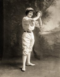 May 14, 1913. "Young woman in pitching stance, full-length studio portrait, wearing a baseball uniform." Gelatin silver print, Stadler Photographing Co., New York-Chicago. View full size.