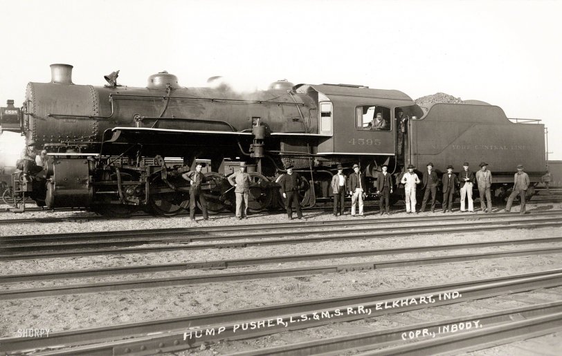 August 19, 1912. "Hump pusher, L.S. &amp; M.S. R.R." On verso: "Made by J. Inbody, Elkhart, Indiana. Home Phone 500." A postcard showing trainmen of the Lake Shore &amp; Michigan Southern Railway and Locomotive 4595. View full size.
