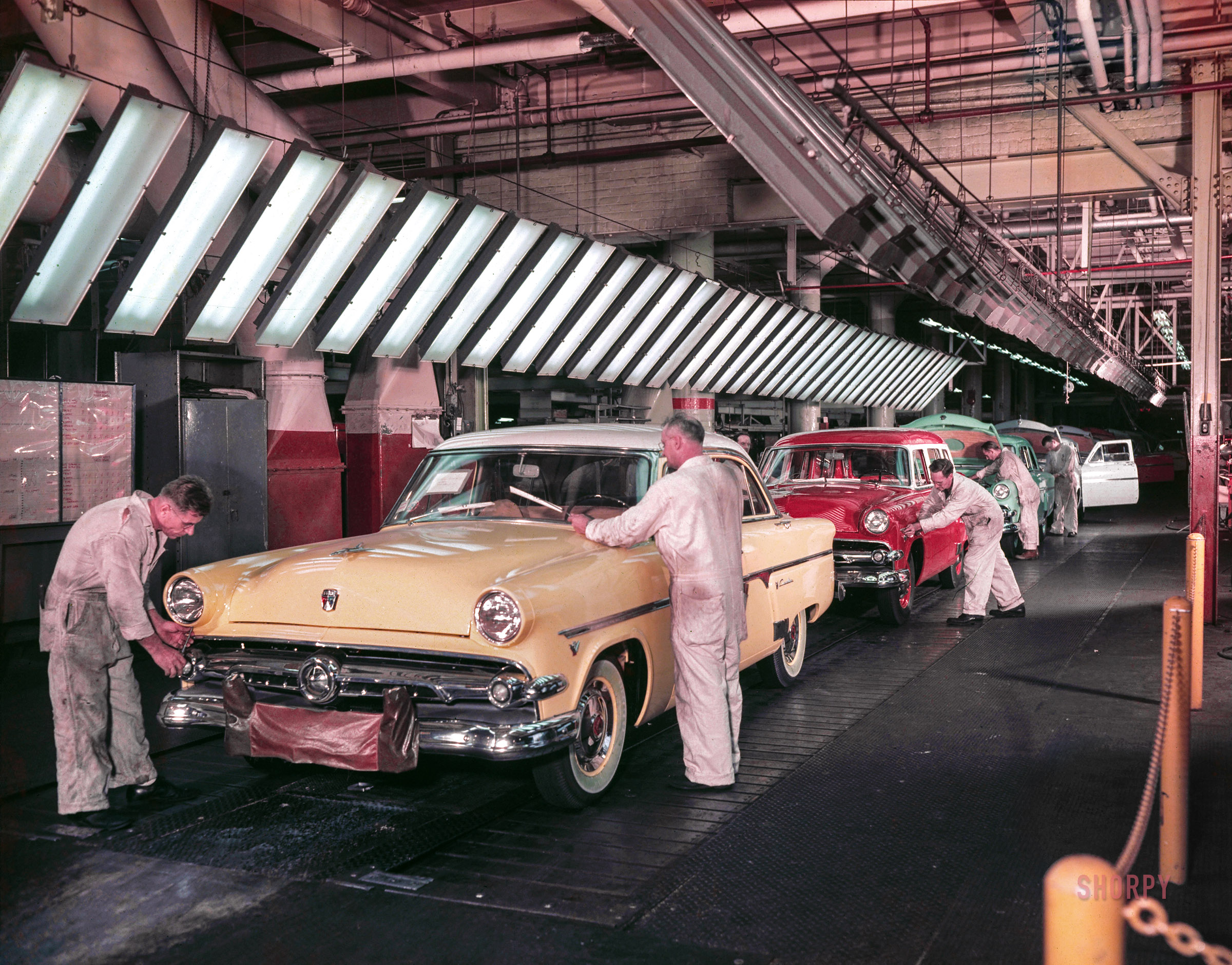 "1954 Fords -- Dearborn assembly plant final line." Watching the Fords go by in a variety of Easter egg hues. Color transparency from the Ford Motor Co. photo archive. View full size.