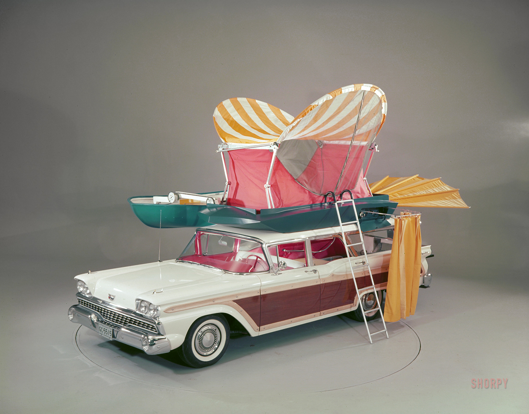 "1959 Ford Country Squire with pushbutton 'Station Wagon Living' equipment." Color transparency from the Ford Motor Co. photographic archive. View full size.
FORD WILL EXHIBIT PLUSH CAMP WAGON
&nbsp; &nbsp; &nbsp; &nbsp; In the experimental station wagon developed by Ford Motor Co., the outdoorsman with a strong push-button finger can set up camp without getting out of the car. First public showing of the easy-does-it camping equipment will be at Eastland Center in Harper Woods ... (Continue reading) 
-- News item, Detroit Free Press, 1958