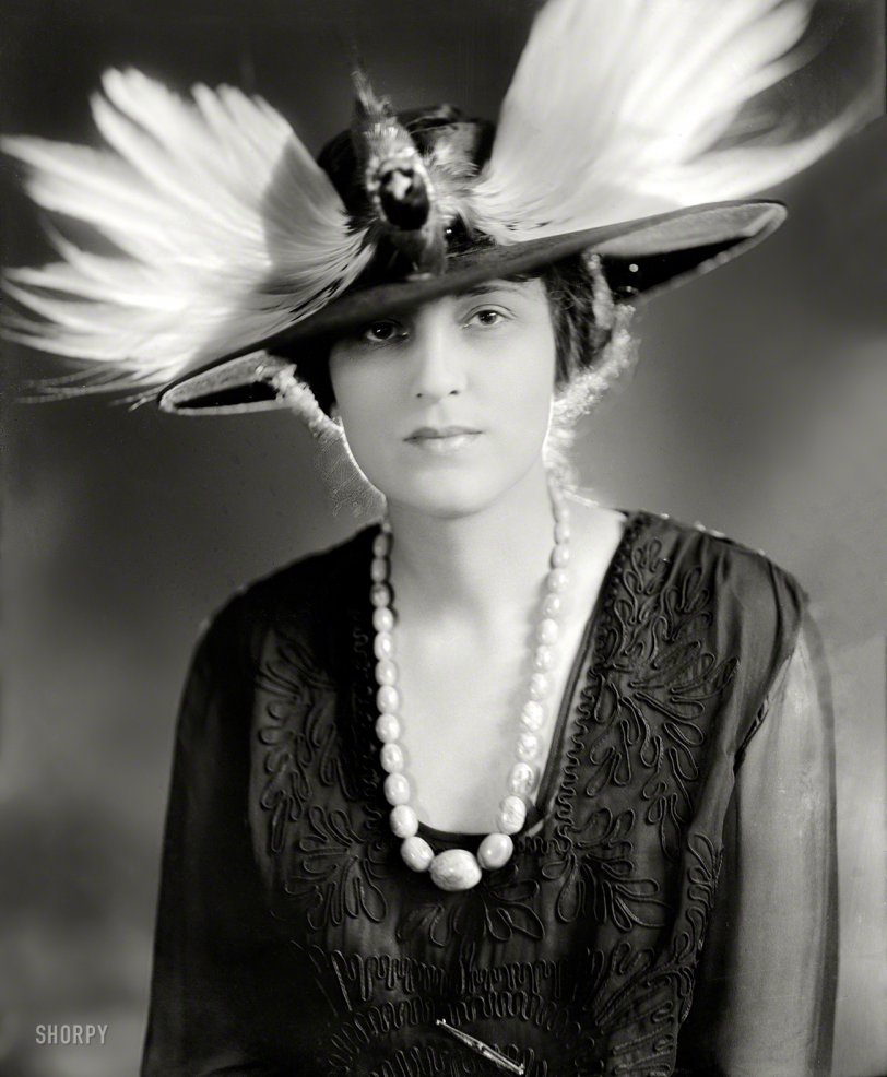 Washington, D.C., circa 1928. "Shelley, James, Mrs." Whose hat is about to attack the camera. Harris &amp; Ewing Collection glass negative. View full size.
