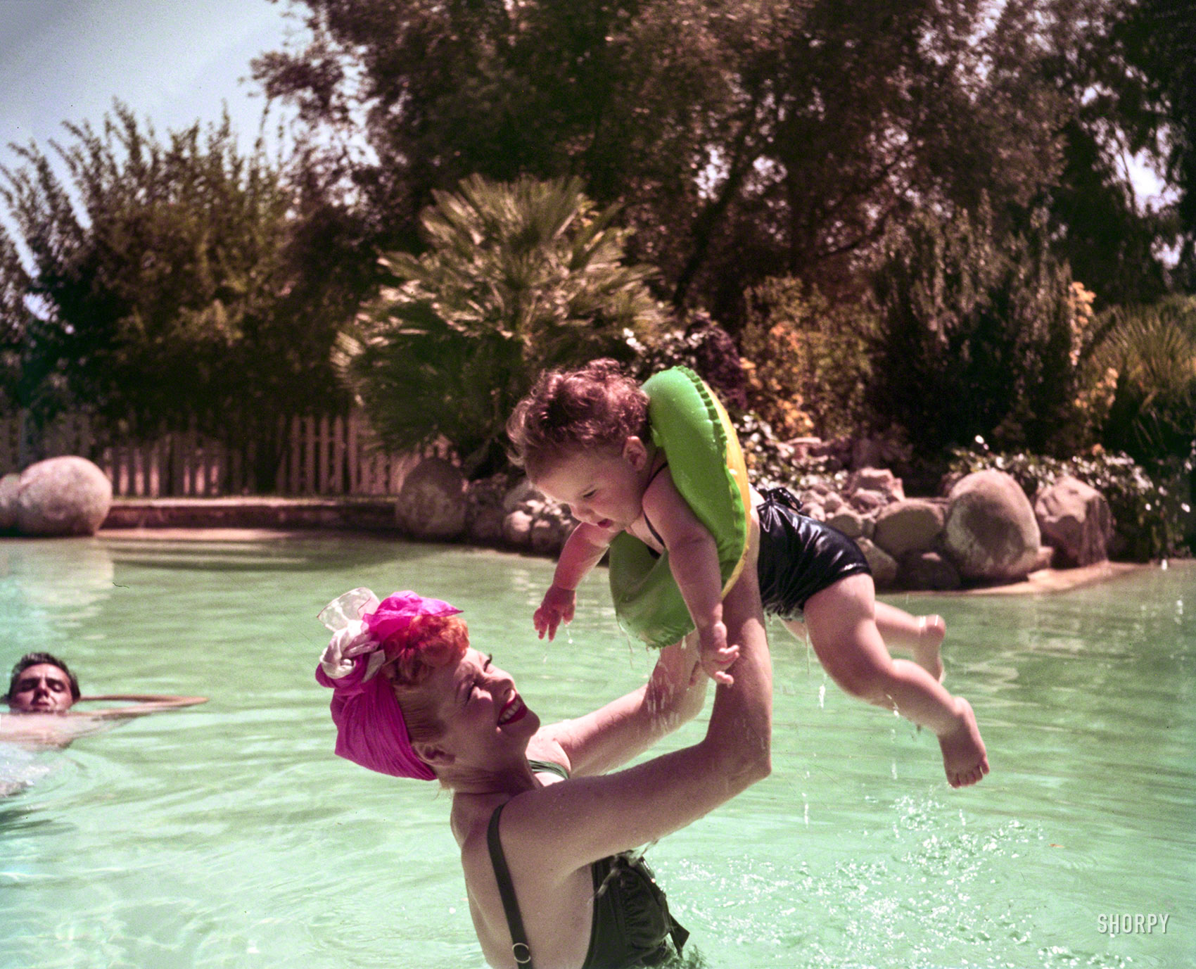 August 1952. "Lucille Ball and Desi Arnaz with their daughter, Lucie, in swimming pool at their home in Palm Springs." Kodachrome by Charlotte Brooks for the Look magazine assignment "The Real Lucy." Happy Mother's Day from Shorpy! View full size.