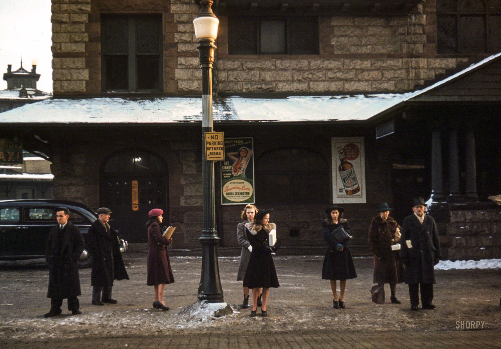 January 1941. Lowell, Mass. "Commuters who have just come off the train, waiting for the bus to go home." 35mm Kodachrome by Jack Delano. View full size.