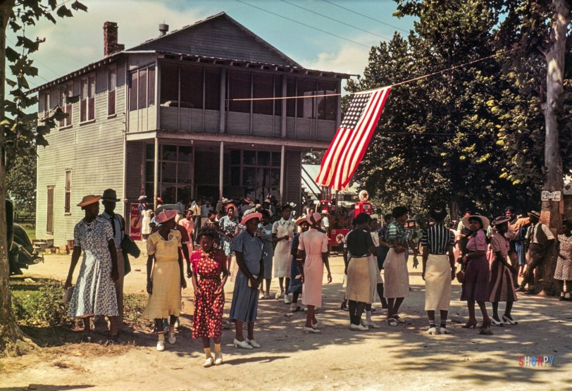 &nbsp; &nbsp; &nbsp; &nbsp; UPDATE: As noted by our astute commenters, the store shown here is now the home of Bill Green's restaurant, Gullah Grub.
July 4, 1939. "A Fourth of July celebration. St. Helena Island, South Carolina." 35mm color transparency by Marion Post Wolcott for the Farm Security Administration. View full size.
