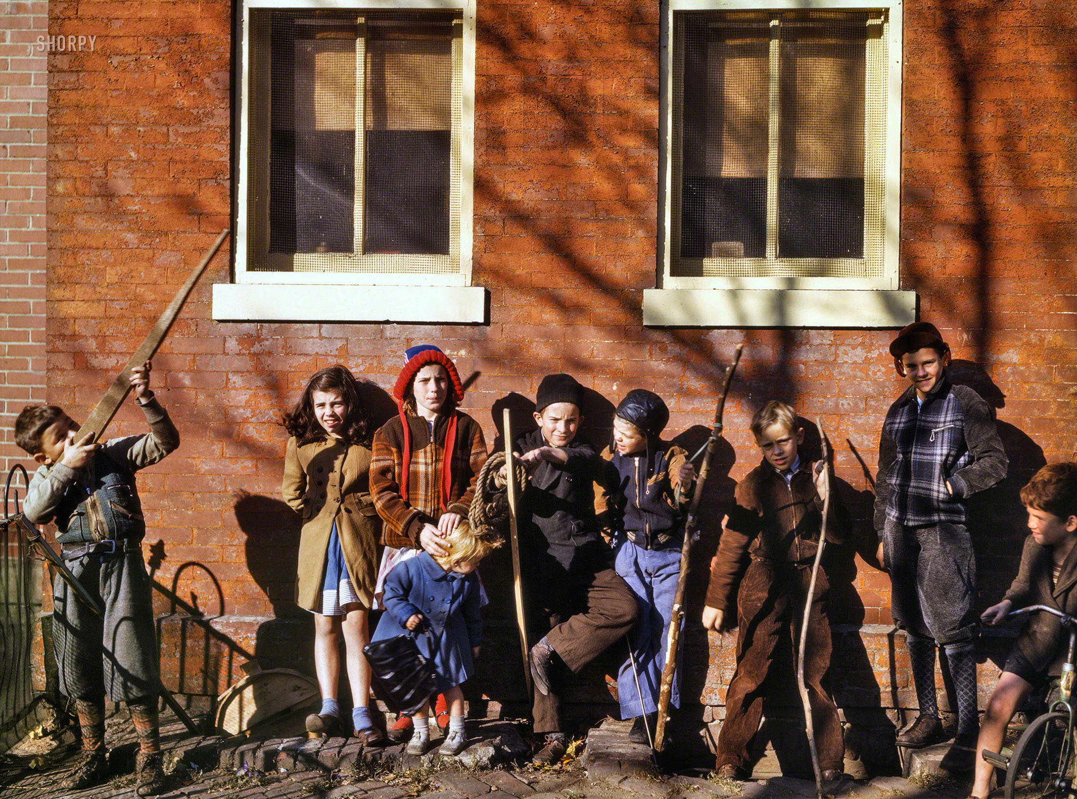 Washington, D.C., 1942. "Children playing, aiming sticks as guns." Kodachrome transparency by Louise Rosskam for the Office of War Information. View full size.