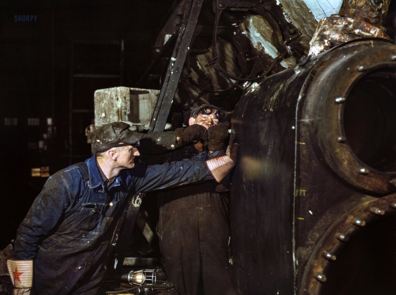 December 1942. "Working on the cylinder of a locomotive at the Chicago &amp; North Western R.R. 40th Street shops, Chicago, Illinois." Kodachrome transparency by Jack Delano for the Office of War Information. View full size.
