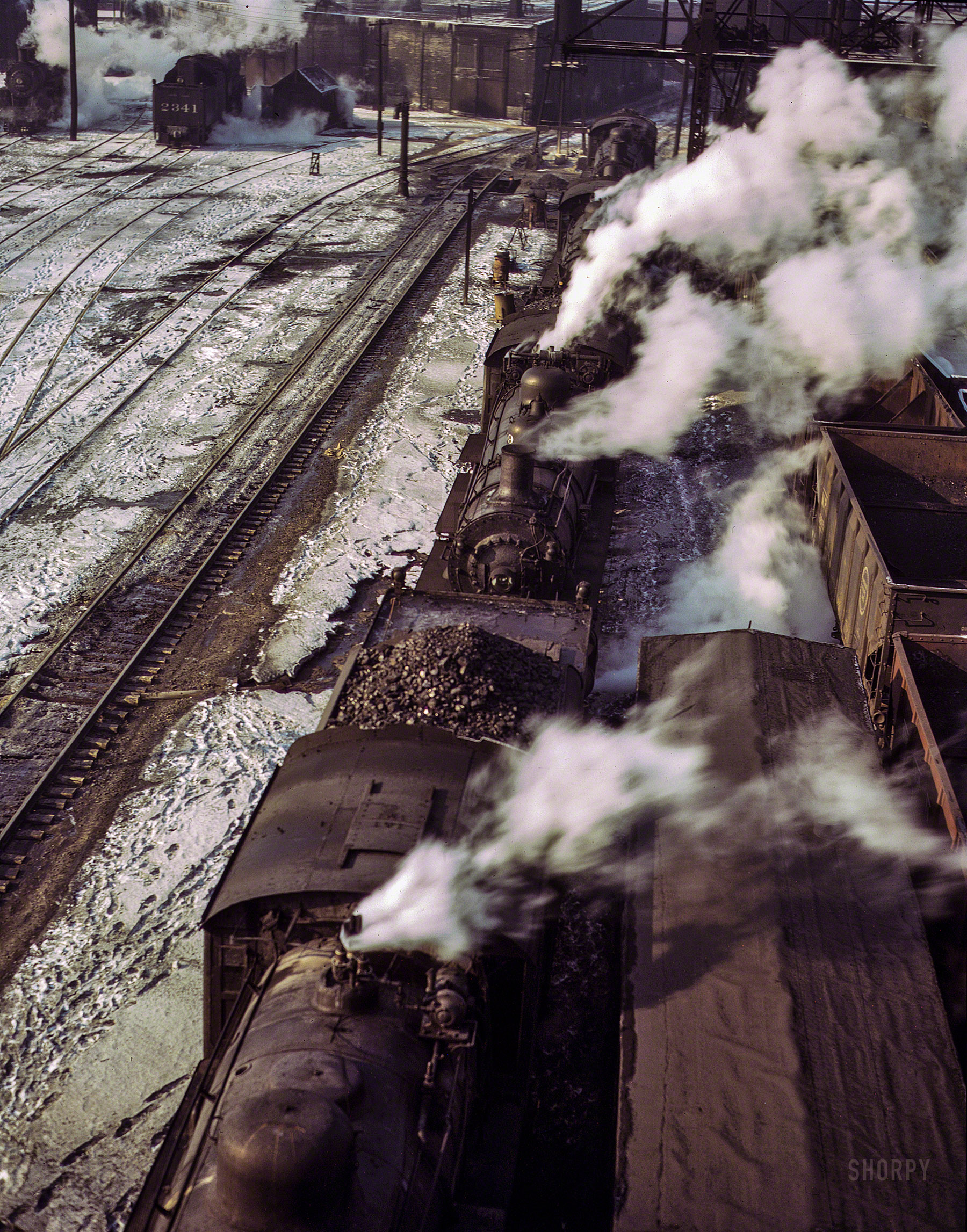December 1942. Chicago. "Locomotives lined up for coal, sand and water at the coaling station in the 40th Street yard of the Chicago & North Western R.R." Kodachrome transparency by Jack Delano. View full size.
