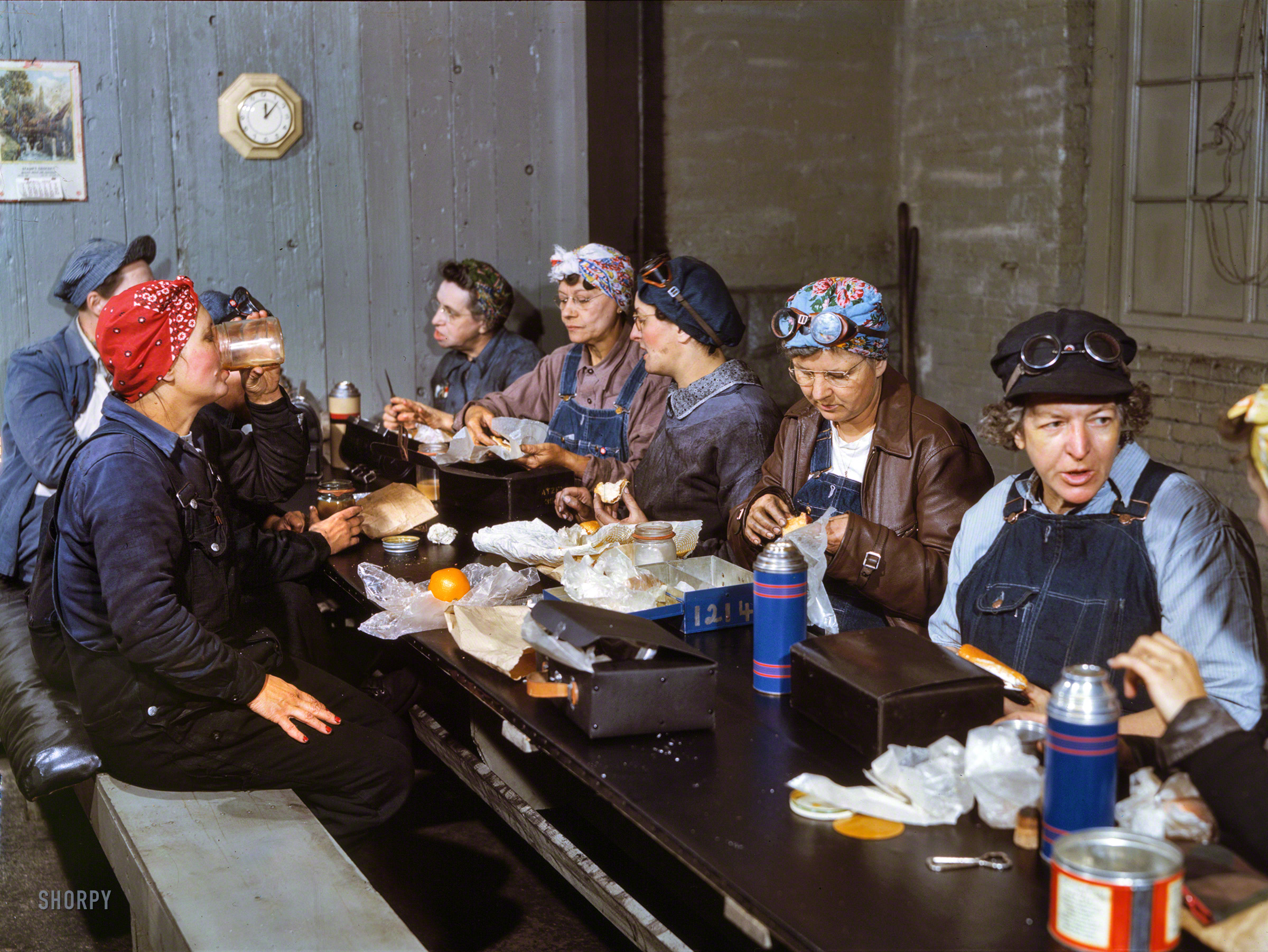 April 1943. "Women workers employed as wipers in the roundhouse having lunch in their rest room, Chicago & North Western Railroad, Clinton, Iowa." Marcella Hart is at left, Mrs. Elibia Siematter at right. Kodachrome transparency by Jack Delano for the Office of War Information. View full size.