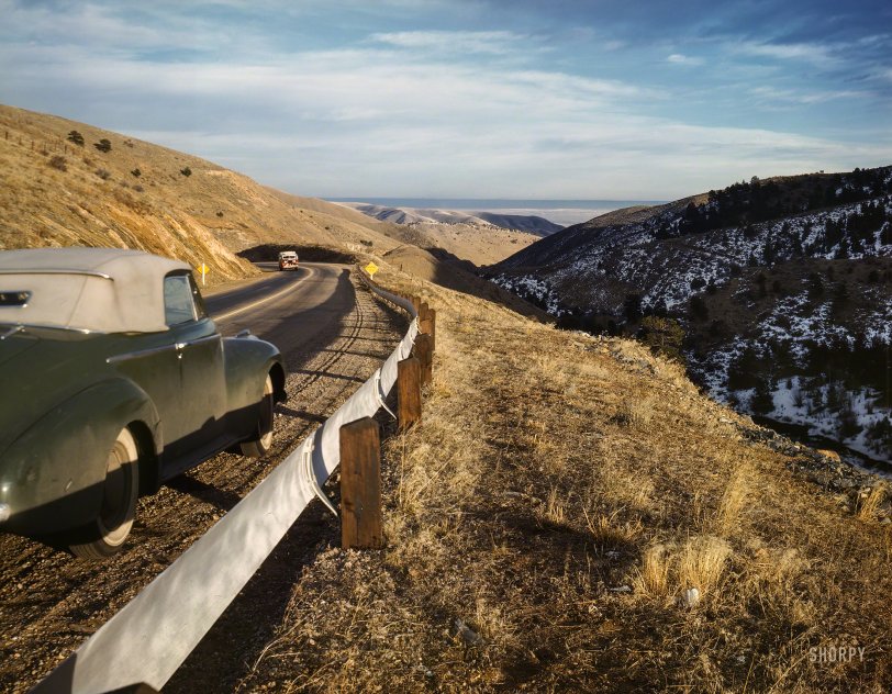 December 1942. "Highway view along U.S. 40 in Mount Vernon Canyon, Colorado. Looking east toward Green Mountain, with Shingle Creek below." Kodachrome transparency by Andreas Feininger, Office of War Information. View full size.
