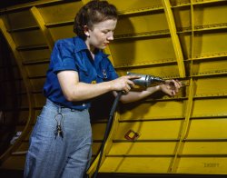 February 1943. "Operating a hand drill at Vultee-Nashville, this woman is working on a 'Vengeance' dive bomber." 4x5 inch Kodachrome transparency by Alfred Palmer for the Office of War Information. View full size.