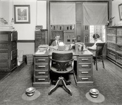 Washington, D.C., circa 1923. "Traffic World office." Tobacco-friendly on both the left and the right. Harris & Ewing Collection glass negative. View full size.
