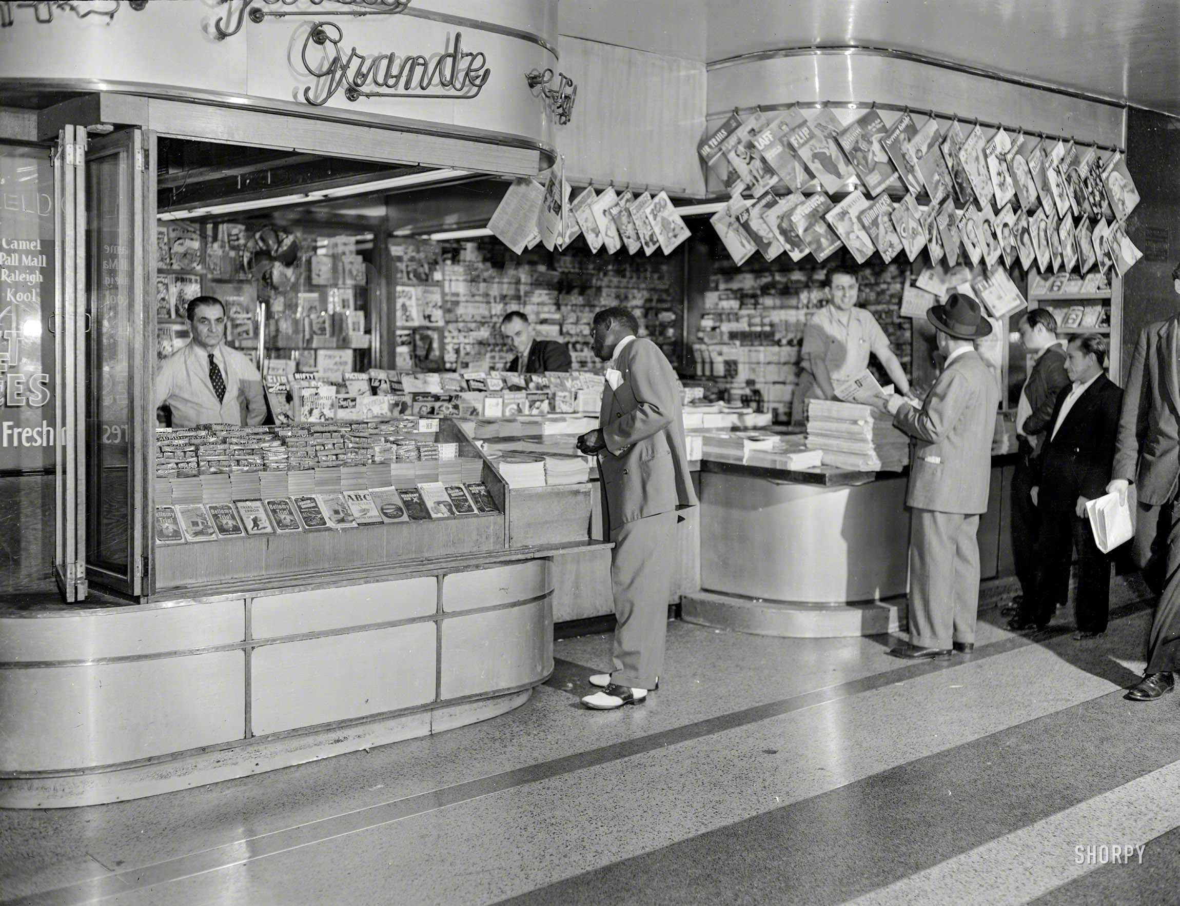 New York, 1946. "Garcia Grande newsstand." With the freshest issues of FLIP, NIFTY and LAFF. 4x5 acetate negative by John M. Fox. View full size.