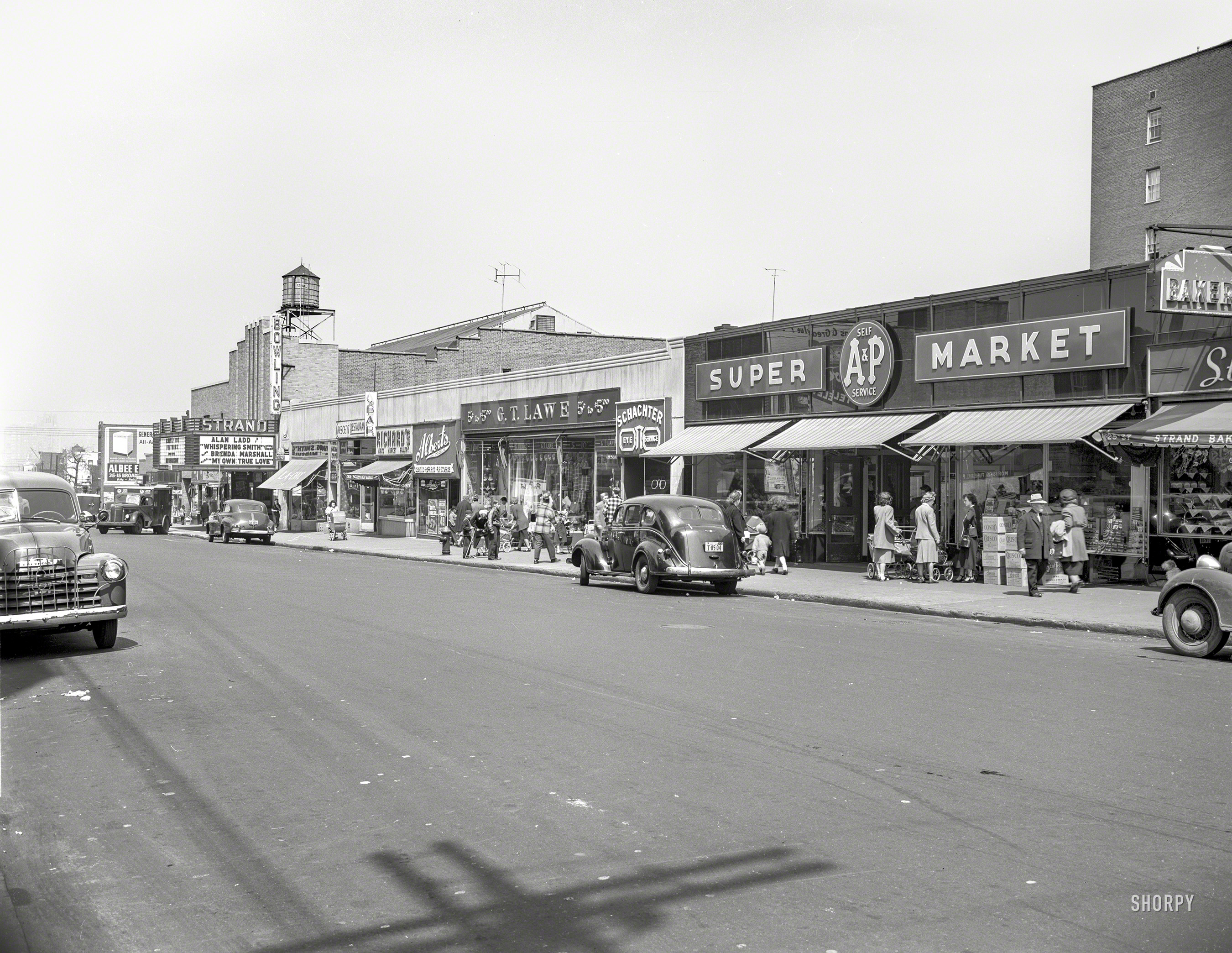 New York, 1949. "A&P Supermarket on Broadway in Queens." Now playing at the Strand: Alan Ladd in Whispering Smith. Photo by John M. Fox. View full size.