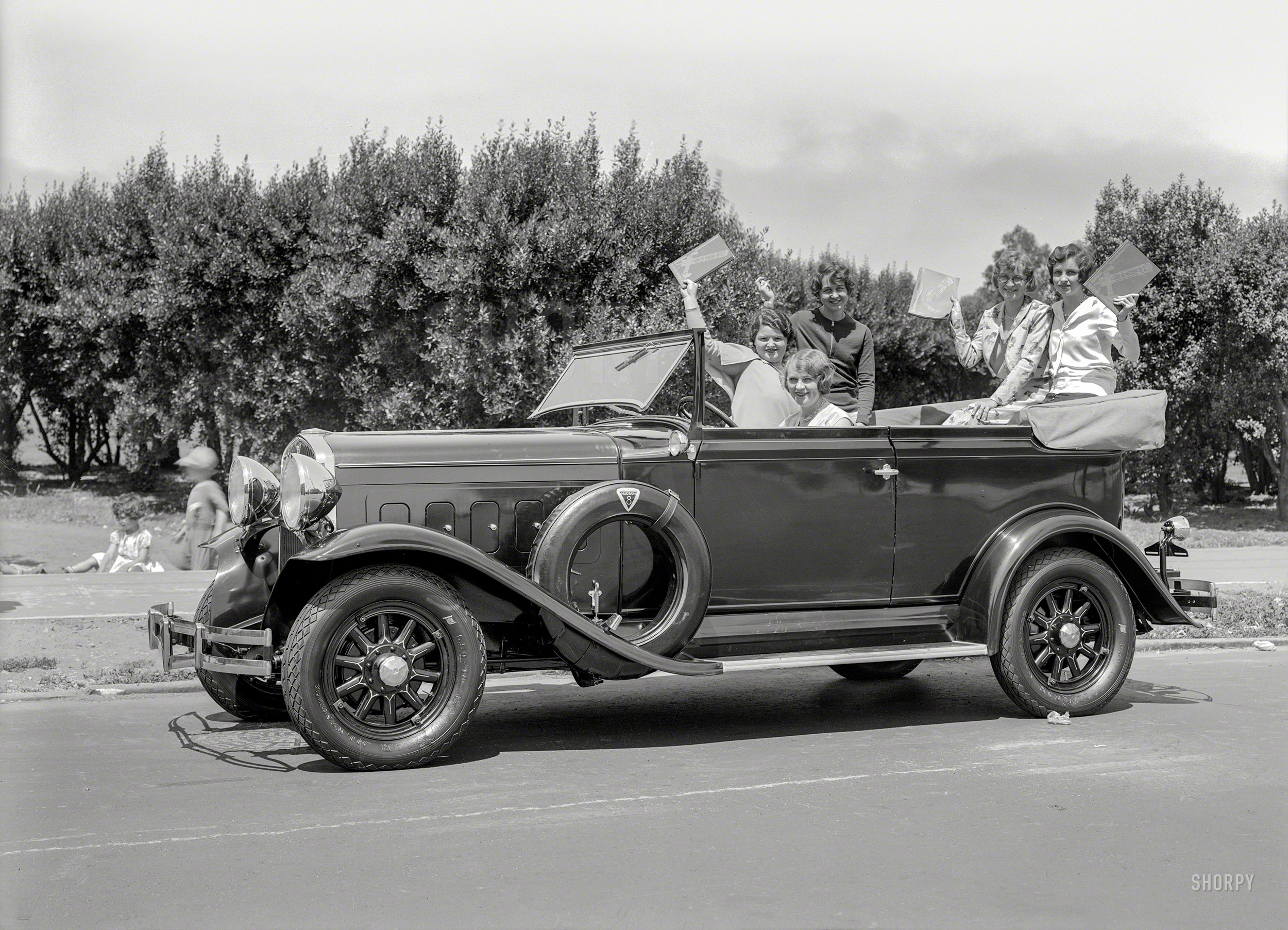 San Francisco circa 1930. "Hudson auto with schoolgirls." Waving yearbooks (?) titled The Telescope. 5x7 glass negative by Christopher Helin. View full size.
