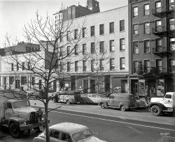 New York, 1951. "Street scene, Corn Exchange Bank." Sharing the spotlight with two Sanitation Department trucks. 4x5 negative by John M. Fox. View full size.