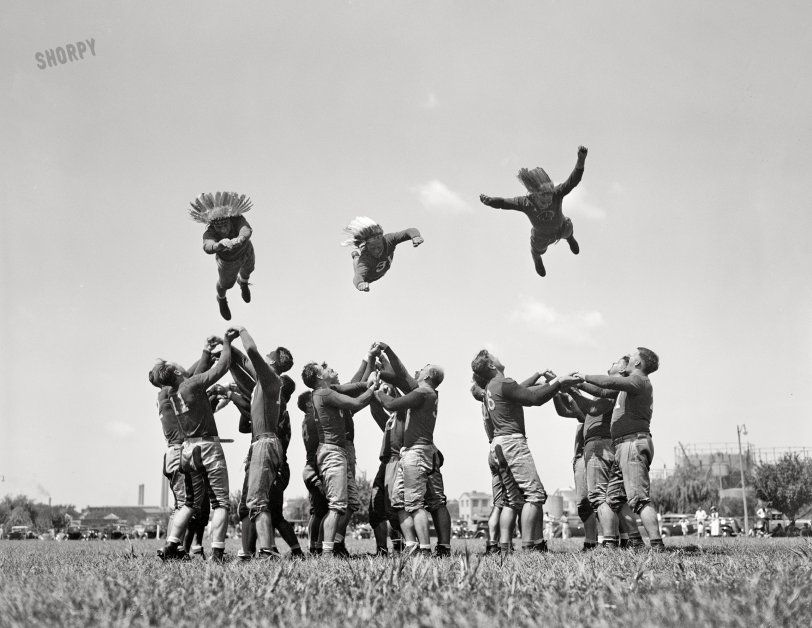 August 28, 1937. Washington, D.C. "Washington Redskins start training. He-man exercise took the place of calisthenics today as the Redskins, Washington's entry in National Professional Football League, started training. The boys 'flying thru the air' are, left to right: Wayne Millner (former Notre Dame star), Pug Rentner (Northwestern) and Nelson Peterson (West Virginia Wesleyan)." 4x5 inch glass negative, Harris & Ewing Collection. View full size.