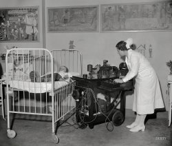 Washington, D.C., circa 1937. "Children's Hospital Rotary." The young man hooked up to a Cambridge Instrument Model X900 Thingamambob. Medical technology experts please weigh in. Harris & Ewing glassneg. View full size.