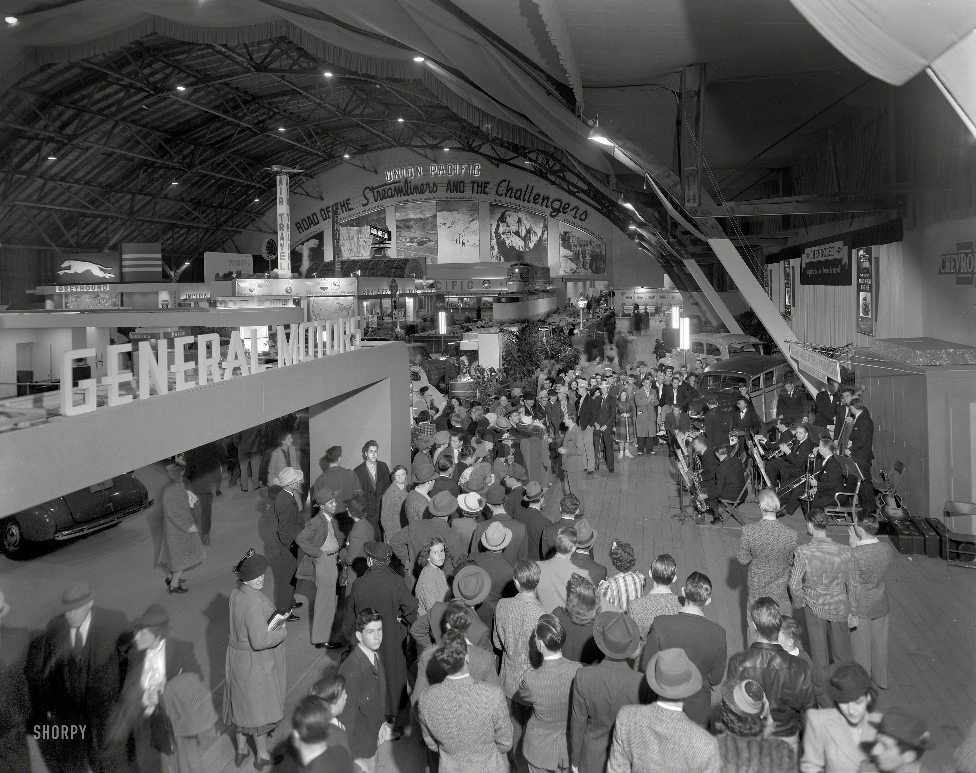 "Golden Gate International Exposition, San Francisco, 1939. Transportation hall." Exhibits by General Motors and Union Pacific dominate this view, with TWA, Greyhound and Santa Fe also showing up. 8x10 acetate negative. View full size.