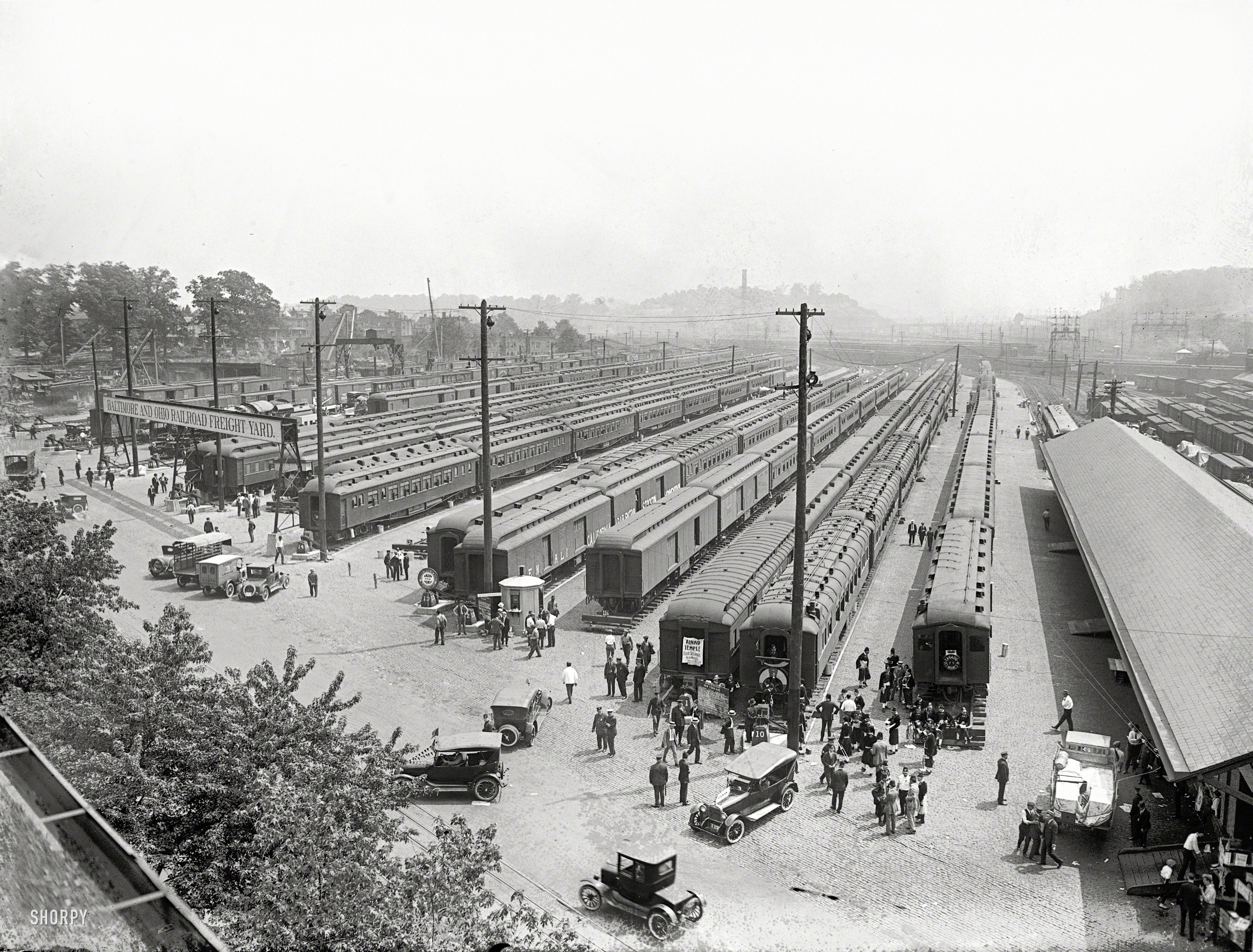 &nbsp; &nbsp; &nbsp; &nbsp; UPDATE: Click here for a better look at the big locomotive barely visible behind the freight yard sign.

"Eckington Yards, June 4, 1923." A rare and unusually detailed look at the Baltimore & Ohio rail yard in Washington, D.C., during that year's big gathering of Masonic lodges. National Photo Company glass negative. View full size.