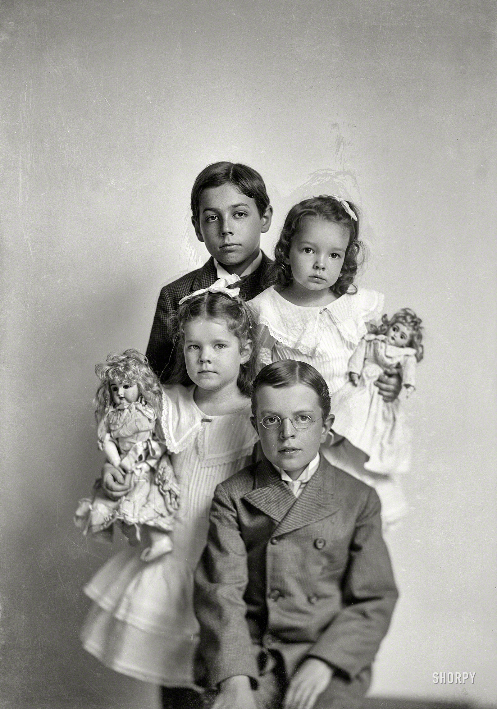 Circa 1905-1915. "Unidentified group (children; girls with dolls)." 5x7 glass negative from the C.M. Bell portrait studio in Washington, D.C. View full size.