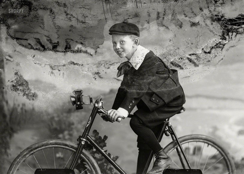 "Boy on bicycle ca. 1895-1916" is the improvised title of this 5x7 dry plate from the C.M. Bell portrait studio in Washington, D.C., whose legacy is a collection of some 30,000 glass negatives recently digitized and catalogued by the Library of Congress after spending the better part of a century in "a succession of basements and farm buildings." View full size.
