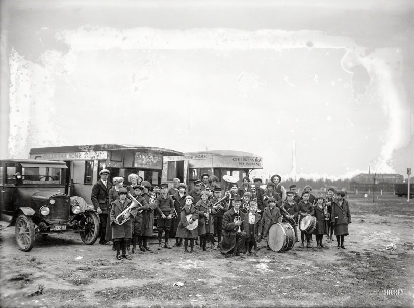 
23 Students Here After
Crossing Continent on Way to Florida.

&nbsp; &nbsp; &nbsp; &nbsp; The tourists' camp in East Potomac park has been temporarily converted into a school. Twenty-three children from 3 to 19 years of age, students of the Draper's Children's Home, of Des Moines, Wash., are making their home there after a five month's trip across the continent.
&nbsp; &nbsp; &nbsp; &nbsp; They left Des Moines in June in a caravan of sleeping trucks, kitchen wagons and closed automobiles, bound for Florida, where they will pass the winter. They arrived here Friday. H.M. Draper, superintendent, heads the school-caravan.
&nbsp; &nbsp; &nbsp; &nbsp; A tutor is with the caravan and the children have daily school sessions. The report of their progress is mailed back to the superintendent of schools in Spokane, Wash., where they normally attend.
&nbsp; &nbsp; &nbsp; &nbsp; Most of the children are musicians or singers. Saturday they serenaded The Washington Post and the District commissioners and they are planning outdoor concerts here for this week.
-- The Washington Post, Nov. 24, 1924

Nov. 25, 1924. Washington, D.C. "Orphans of Des Moines, Wash., at tourist camp." National Photo Company Collection glass negative. View full size.

