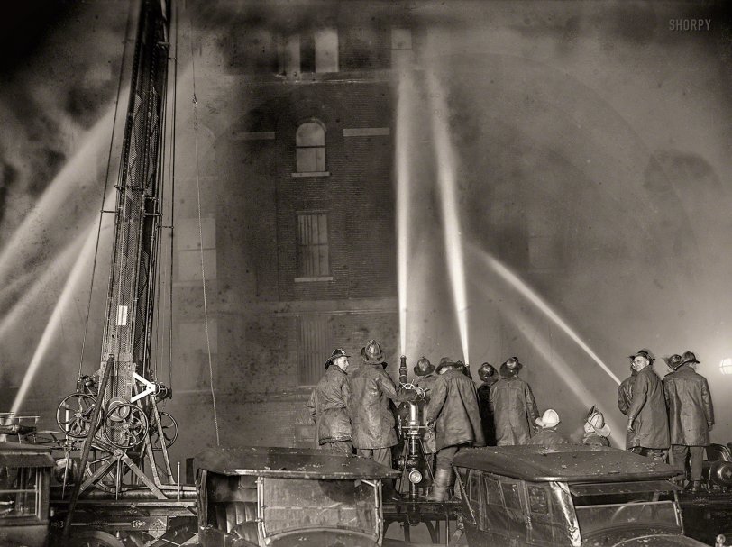 &nbsp; &nbsp; &nbsp; &nbsp; A spectacular fire that spread with a rapidity that stunned firemen virtually destroyed the five-story warehouse of S. Kann &amp; Sons, at Eighth and D streets northwest, shortly after 7 o'clock last night. Merchandise valued at $175,000 was destroyed by the fire, which raced through the building as though fanned by a giant bellows.
&nbsp; &nbsp; &nbsp; &nbsp; It is believed that a cigarette was accidentally thrown into a basket of excelsior and that the basket was moved into the packing room from the street. -- Washington Post
January 10, 1925. Washington, D.C. "Fire at S. Kanns warehouse, Eighth and D streets N.W." National Photo Company Collection glass negative. View full size.
