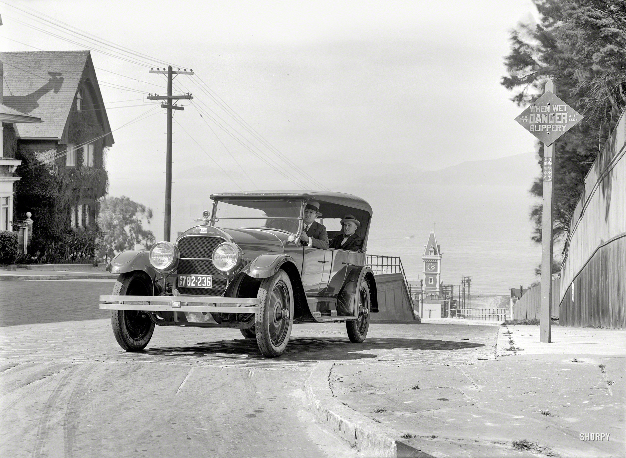 "Flint auto in San Francisco, 1924." With the Ghirardelli Square clock tower keeping time for whatever conversation is taking place between the front seat and the back. 5x7 inch glass negative by Christopher Helin. View full size.