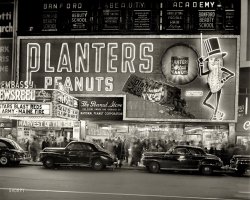 New York circa 1947. "National Peanut Corp. store on Broadway -- Mr. Peanut sign and Embassy Newsreel Theatre." 4x5 negative by John M. Fox. View full size.