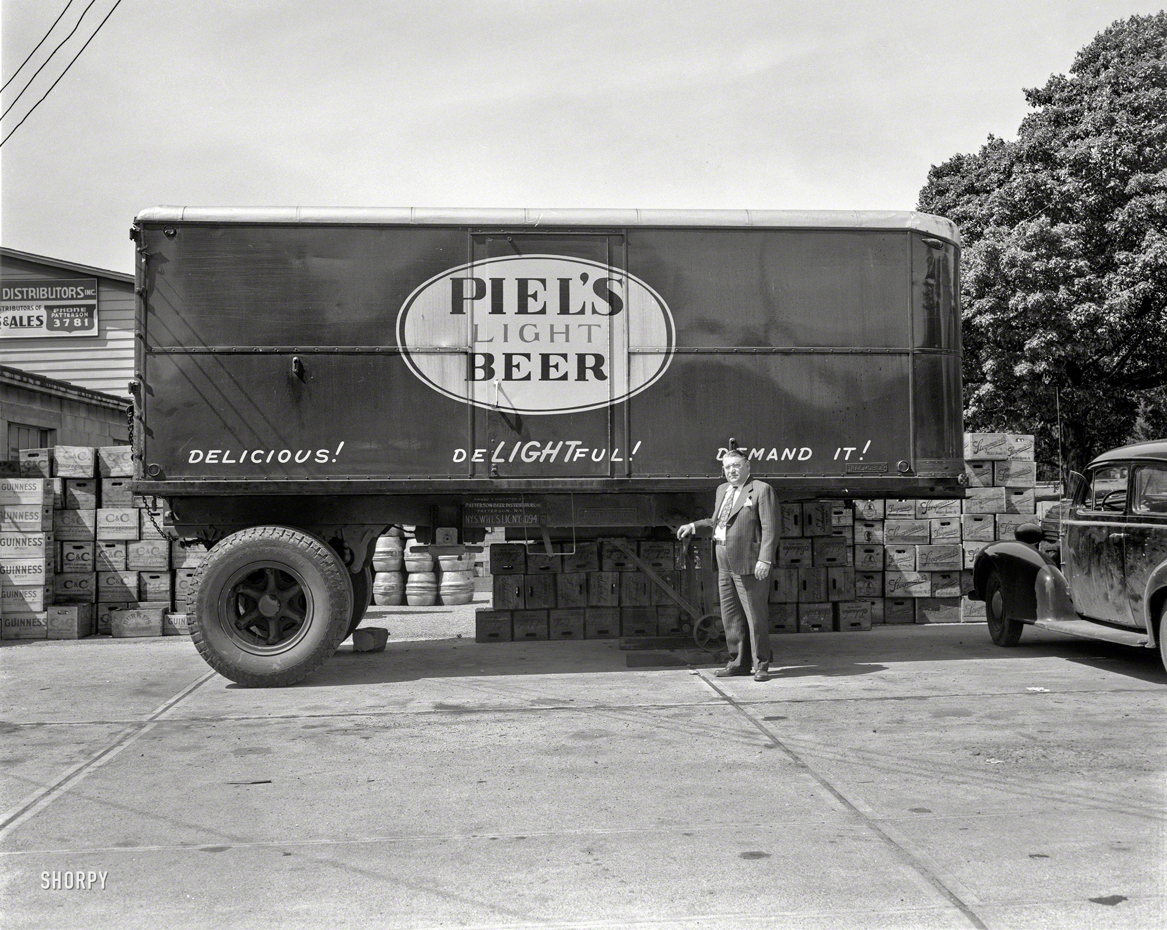 New York circa 1948. "Patterson Beer Distributors -- Piel's Beer truck." It's Delic&shy;ious, DeLIGHTful, Demand It!  4x5 negative by John M. Fox. View full size.