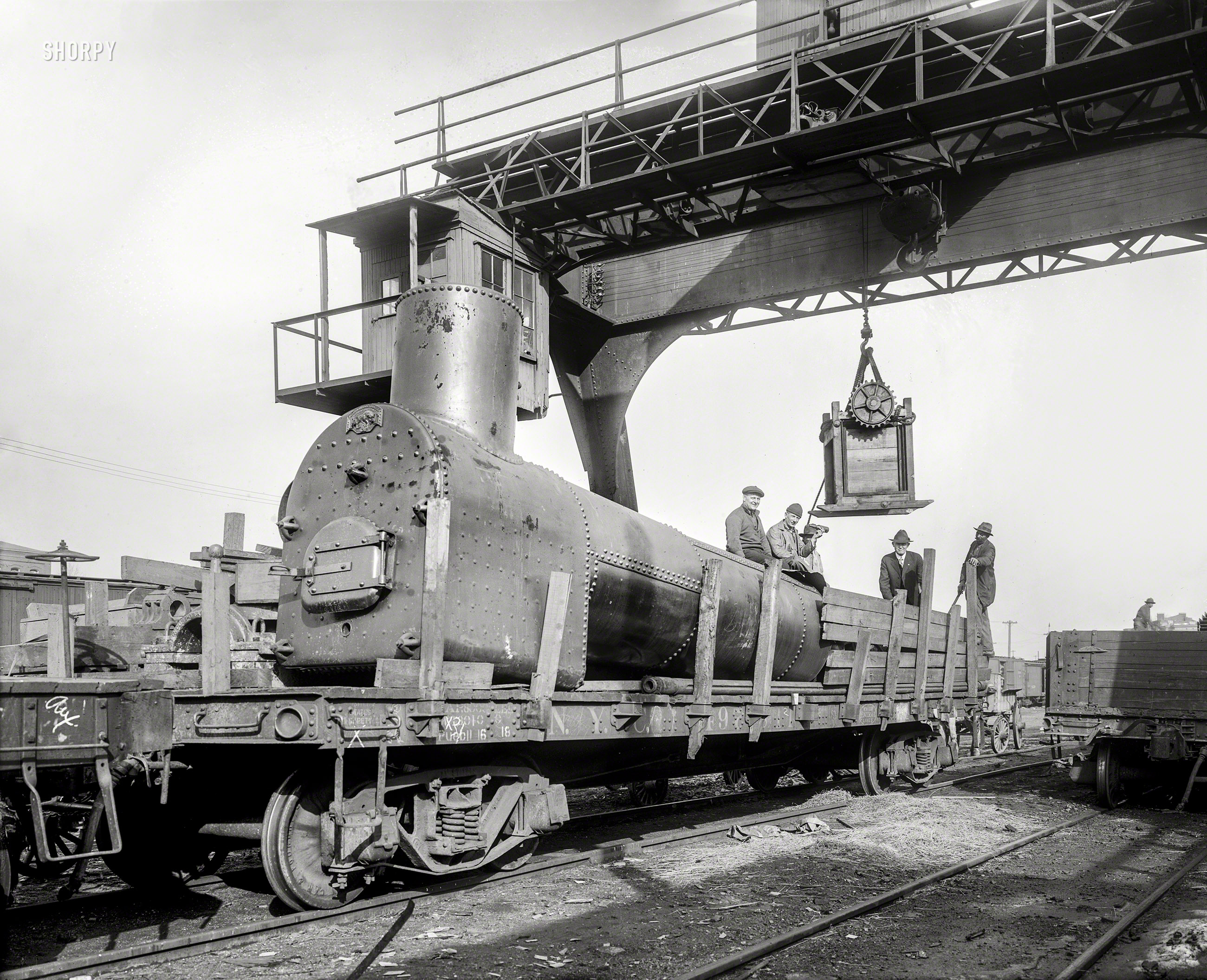 Washington, D.C., circa 1920. "Washington Times -- Oil Co." is all it says on this glass negative showing a rusty coal-fired boiler, a crate on skids and a guy holding a beer bottle. National Photo Company Collection. View full size.