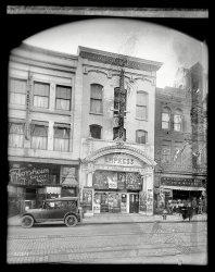 Washington, D.C., circa 1920. "Empress Theater, Ninth Street N.W. (Washington Herald)." Now playing: Tom Mix in The Speed Maniac, sandwiched between Hong Kong Restaurant and the Marines. National Photo glass negative. View full size.