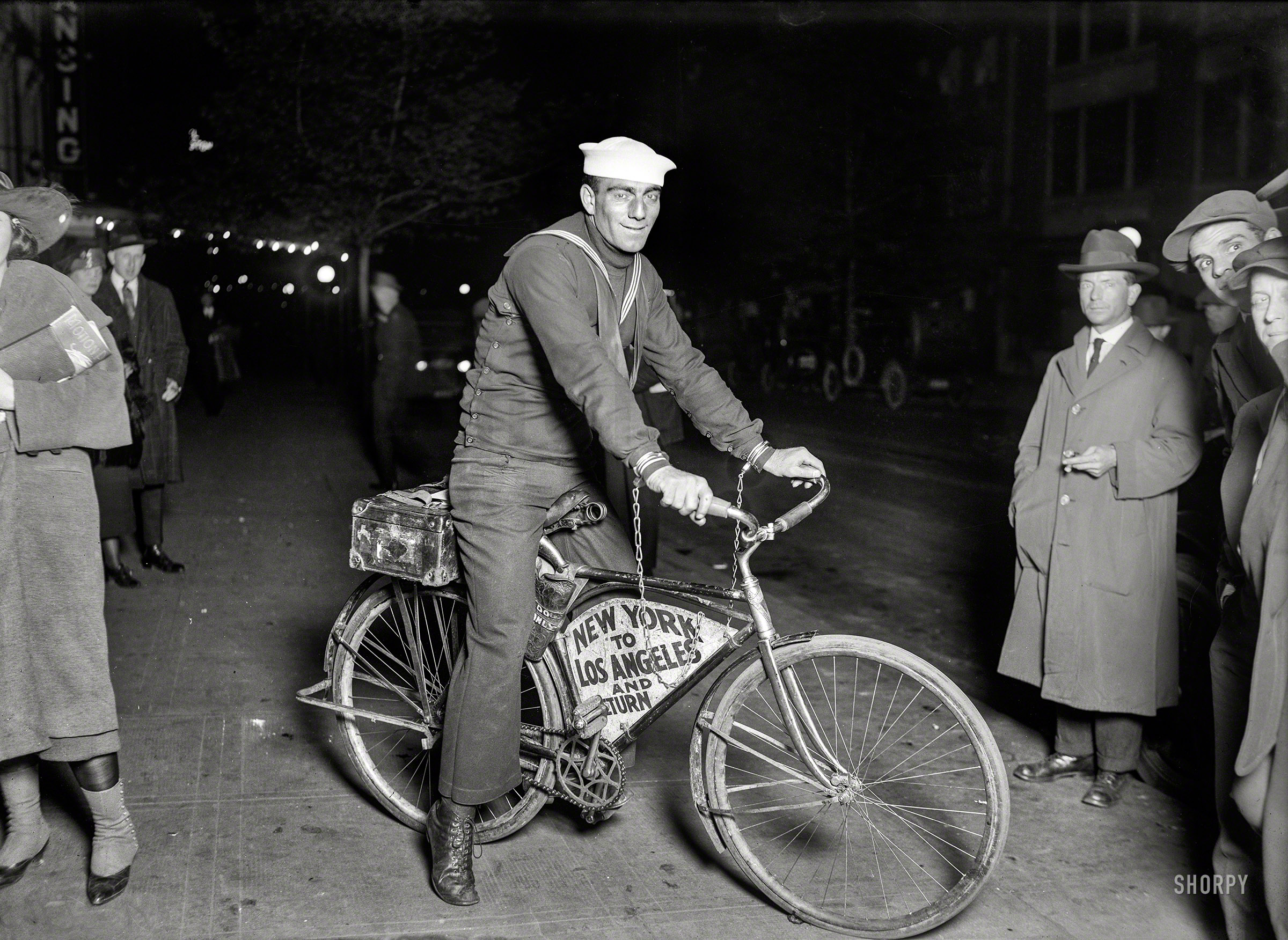 May 1920. "Sailor Tony Pizzo passing through Washington on a Coast to Coast bicycle run handcuffed to his machine. The handcuffs were sealed by Mayor Hylan in New York April 24 and are not to be opened until his return to that city. Pizzo made a California to New York trip in like manner in 1919." View full size.