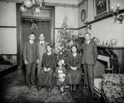 Washington, D.C., circa 1922. "Japanese legation -- military attache of the Japanese Embassy." General Hatsutaro Haraguchi, second from left; the girl with the doll is his daughter Kukiko. National Photo glass negative. View full size.