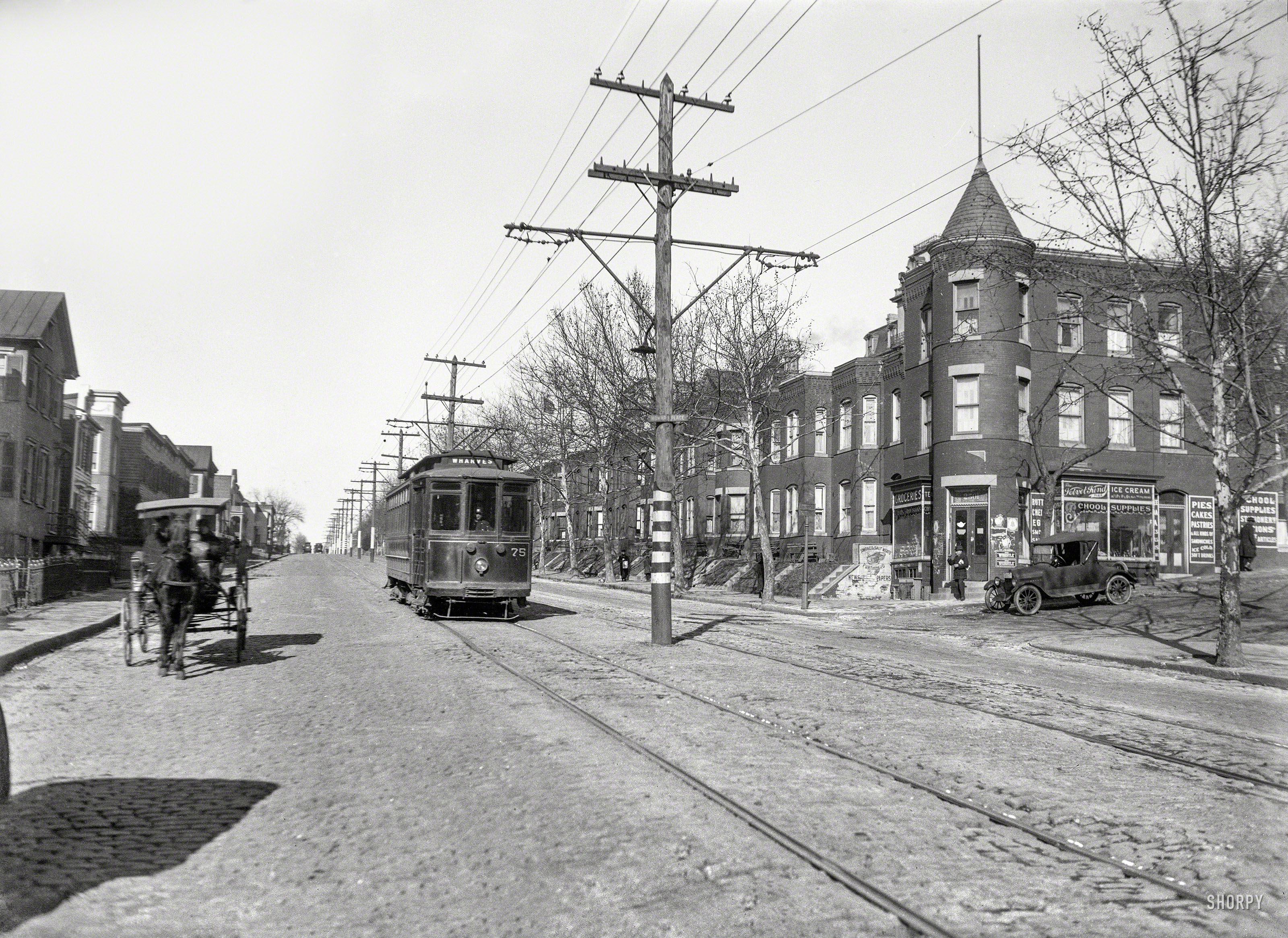 Washington, D.C., circa 1921, looking up Georgia Avenue at Howard Place, and Jacob Katzen's grocery, dealer in Velvet Kind ice cream and Whistle. Another Harris & Ewing glass negative from the "traffic" series. View full size.