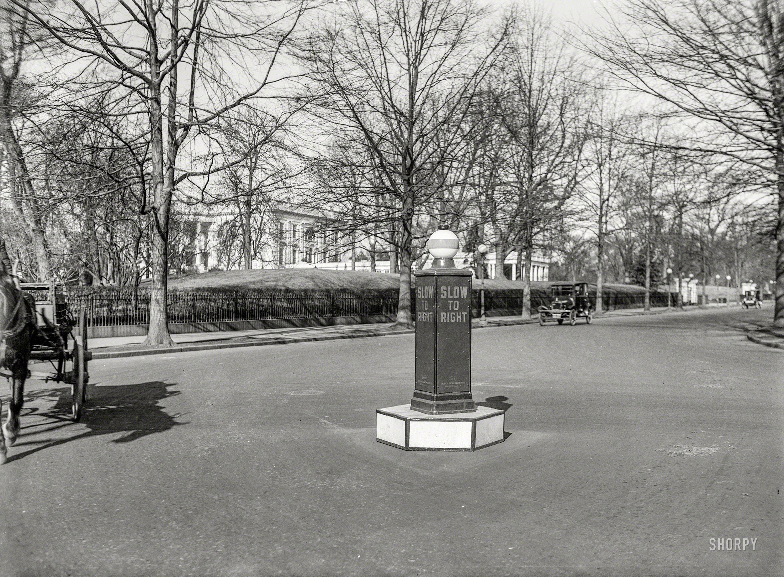 Washington, D.C., circa 1922. "NO CAPTION (Street near White House)." Another of the Harris & Ewing "traffic" photos, this one showing what looks like a wayward gas pump. 5x7 inch glass negative. View full size.