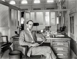 Washington, D.C., circa 1920. "Herbert E. French, photographer, in office." The proprietor of the National Photo Company, stylishly coordinated with a natty three-button desk. 8x6 inch glass negative, National Photo Co. View full size.