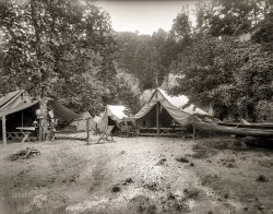On the banks of the Potomac circa 1914. "Summer camps: G. Whiz Canoe Club." 8x6 inch glass negative, National Photo Company Collection. View full size.